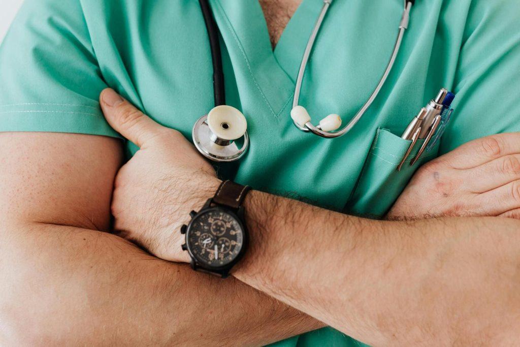 A urologist carrying a stethoscope