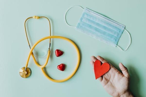 medical stethoscope and mask with red hearts
