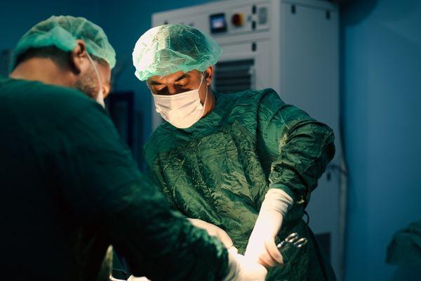 Vasectomy operation being performed by doctors